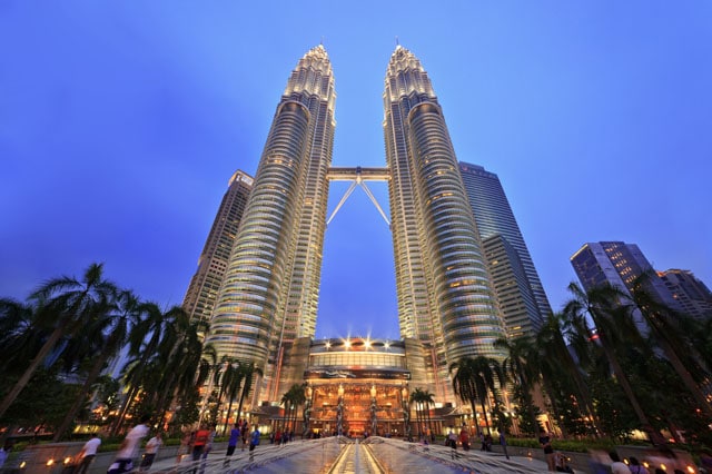 Petronas Towers in Kuala Lumpur, Malaysia, were the tallest buildings in the world from 1998 to 2004 and remain the tallest twin towers. Photo courtesy of Noppasin/Shutterstock.